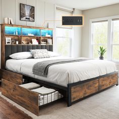 a bed with drawers underneath it in a bedroom