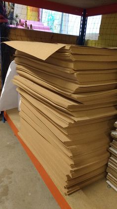 a large stack of brown paper sitting on top of a table