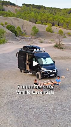 an rv parked on top of a gravel field