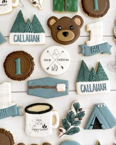 some cookies are arranged in the shape of mountains and trees, including one with a bear