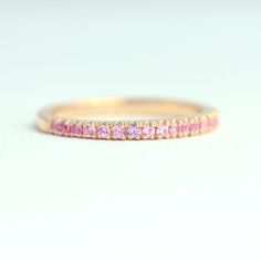 18K Yellow Gold Pink Sapphire Ring, 3/4 Eternity Ring, Natural Pink Sapphire Wedding Band, 1.5mm Half Eternity Band, Micro Pave Wedding Ring ♥ Details Handmade to order * Genuine Pink Sapphire Band in 3/4 eternity * Gemstone type: Natural Pink Sapphires * Total Carat Weight: 0.44 carats * Sapphire size: 1.5mm each * Sapphire Cut: Round Brilliant fully Faceted Diamond Cut * Metal: Solid 18K Gold (available in 14K and 18K White, Yellow, and Rose Gold, and 950 platinum) * Ring size: US 3-10 (Please Pink Sapphire Wedding Band, Pave Wedding Ring, Micro Pave Band, Pink Sapphire Band, Pave Wedding Rings, Sapphire Band, Pink Sapphire Ring, Pave Band, Half Eternity Band