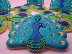 some cookies that are decorated like peacocks