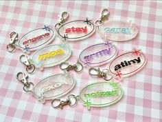 six keychains with the words stay calm on them in different colors and styles