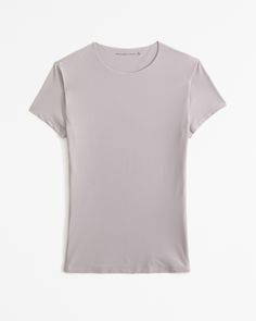 Our new slim-fitting short-sleeve tee in our elevated, barely-there soft matte seamless fabric and tuckable length, with crew neckline and straight hem. Our buttery Soft Matte fabric hugs your body in lightweight compression, with a flattering all-over blur, that's perfect for every body, every day. Female Features, Pocket Tee Shirts, Matte Fabric, Grey Material, Distressed Black Jeans, Baby Tee, Dress With Bow, Everyday Style, Women's Tops