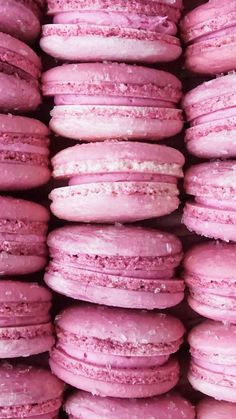 pink macaroons stacked on top of each other