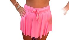 High waisted mini athletic skort with shorts underneath. Skirt is higher on the sides and lower in the back for more coverage. Barbie Pink color. Sports Mini Skirt With Built-in Shorts For Summer, Stretch Tennis Skirt With Built-in Shorts For Beach, Spring Cheerleading Skort With Built-in Shorts, Stretch Mini Skirt With Built-in Shorts For Vacation, Stretch Mini Skirt With Built-in Shorts For Day Out, Summer Sporty Skort With Built-in Shorts, Solid Athletic Shorts With Short Inseam For Spring, Casual Beach Skort With Built-in Shorts, Trendy Stretch Summer Skort