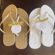 three pairs of wedding flip flops with bows