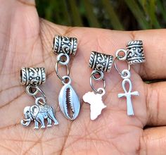 4 pcs Sisterlocks Jewelry, Small Dreadlock jewelry, hair accessories, ethnic *For small dreads, braids, twists or sisterlocks *You will receive 4 small pieces *7 mm hole size *4 piece set with small alloy steel silver charms, Elephant, Ankh, Africa, and cowrie shell *How to properly take care of your jewelry  1. Remove jewelry before showering or swimming, avoid any contact with water lotions or perfume  2. If your Jewelry starts to look dull just clean with white vinegar and fiber cloth 3. When Small Dreads, Track Hairstyles, Dreadlock Jewelry, Jewelry Hair Accessories, Loc Jewelry, Human Braiding Hair, Jewelry Hair, Sisterlocks, Cowrie Shell