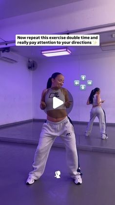 two women are in a dance studio with purple lighting