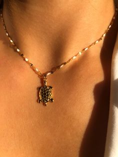 TORTUGA * Ultimate Summer necklace 100% Stainless Steel  * Gorgeous shiny chain with white enamel detail  * Turtle pendant 14x25 (s.Steel) gold * Waterproof  * Tarnish free * Adjustable 40-50 cm * 100% good vibes! ➪  𝐴𝑙𝑙 𝑃𝑟𝑜𝑑𝑢𝑐𝑡𝑠 𝑎𝑟𝑒 𝑐𝑎𝑟𝑒𝑓𝑢𝑙𝑙𝑦 𝑝𝑎𝑐𝑘𝑎𝑔𝑒𝑑 𝑤𝑖𝑡ℎ 𝑙𝑜𝑣𝑒.  ➪  𝑃𝑎𝑐𝑘𝑎𝑔𝑒 𝑖𝑛𝑐𝑙𝑢𝑑𝑒𝑠: 𝐼𝑡𝑒𝑚 (𝑜𝑓 𝑐𝑜𝑢𝑟𝑠𝑒), 𝑎 𝑙𝑜𝑣𝑒𝑙𝑦 𝑔𝑖𝑓𝑡 𝑝𝑜𝑢𝑐ℎ. ✲ 𝑇ℎ𝑒 𝑟𝑒𝑐𝑜𝑚𝑚𝑒𝑛𝑑𝑒𝑑 𝑐ℎ𝑎𝑖𝑛 𝑠𝑖𝑧𝑒 𝑓𝑜𝑟 𝑡ℎ𝑖𝑠 𝑖𝑡𝑒𝑚 𝑖𝑠 45 𝑐𝑚. ♡  𝐼𝑓 𝑦𝑜𝑢 𝑎𝑟𝑒 ℎ𝑎𝑣𝑖𝑛𝑔 𝑠𝑜𝑚𝑒 𝑠𝑝𝑒𝑐𝑖𝑎𝑙 𝑟𝑒𝑞𝑢𝑒𝑠𝑡 𝑝𝑙𝑒𝑎𝑠𝑒 𝑐𝑜𝑛𝑡𝑎𝑐𝑡 𝑚𝑒 - 𝐼'𝑚 ℎ𝑎𝑝𝑝𝑦 𝑡𝑜 ℎ𝑒𝑙𝑝 𝑦𝑜𝑢 𝑓𝑖𝑛𝑑 𝑤ℎ𝑎𝑡 𝑦𝑜𝑢 𝑎𝑟𝑒 𝑙𝑜𝑜𝑘𝑖𝑛𝑔 𝑓𝑜𝑟 :) ➤ 𝐹𝑖𝑛𝑑 𝑎𝑙𝑙 𝑛𝑒𝑐𝑘𝑙𝑎𝑐𝑒𝑠 ℎ𝑒𝑟𝑒: https://www.etsy.com/shop/LupusJewelryGR?ref=seller-platform- White Chain Necklace For The Beach, White Chain Necklace For Beach, White Charm Necklace With Pendant, White Gold-plated Charm Necklace With Adjustable Chain, White Gold Plated Charm Necklace With Adjustable Chain, White Pendant Charm Necklace With Chain, White Gold Plated Charm Necklaces With Lobster Clasp, Love Package, Jewelry Ocean