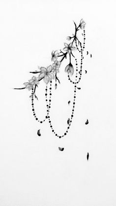 a black and white drawing of flowers on a string with beads hanging from it's end