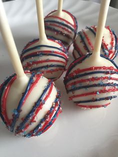 red, white and blue cake pops on a plate