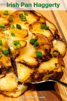 a close up of a pizza on a wooden surface with the words irish pan hagerty