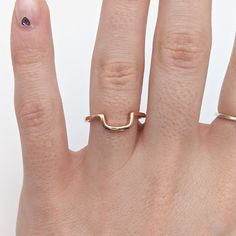 Elevate your wedding set with our Minimalist Solid 14k Gold Curved Wedding Band. Custom made to stack with your ring, this geometric piece adds a touch of sophistication, enhancing any engagement ring. Made with high quality 14k gold, this stacking band exudes understated elegance. Rose Gold Recycled Gold Stackable Rings For Wedding, Modern 14k Gold Wedding Jewelry, Simple Recycled Gold Wedding Jewelry, Minimalist Yellow Gold Open Band Wedding Ring, Modern Jewelry With Simple Design For Wedding, Modern 14k Rose Gold Jewelry For Wedding, Minimalist Yellow Gold Open Band, Modern Simple Design Jewelry For Wedding, Modern Simple Wedding Jewelry