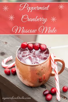 a copper mug filled with cranberry moscow mule next to candy canes and candies