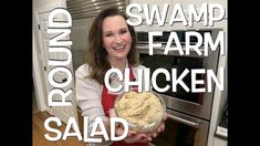 a woman holding a bowl of food in front of an oven with the words swamp farm chicken salad on it