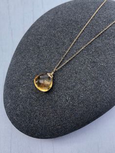 Yellow Topaz Necklace, November Birthstone, Yellow Topaz Teardrop Pendant, Solid 14k Gold, Real Gold Jewelry, Minimal Layering, Gift for her This beautiful dainty necklace features a flawless quality 8 mm micro faceted yellow topaz chubby teardrop wire wrapped in Solid 14k yellow gold. The yellow topaz pendant is suspended from a dainty solid 14k yellow gold chain. This is an everyday necklace, perfect for a gift for a girl born in November, as this is their birthstone. All element in this neckl Yellow Gold Briolette Gemstone Drop Necklace, Teardrop Topaz Yellow Gold Jewelry, Yellow Gold Topaz Teardrop Jewelry, Pear Shaped Citrine Gemstone Jewelry, Pear-shaped Citrine Gemstone Jewelry, Fine Jewelry Gold Drop Gemstones, Teardrop Citrine Gemstone Necklace, Citrine Drop Gemstone Jewelry, Faceted Citrine Drop Jewelry