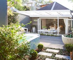 an outdoor patio with a table and chairs