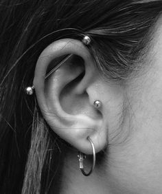 a woman with ear piercings on her ears