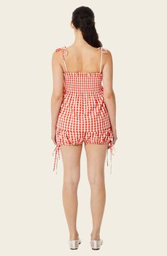 Go for retro style in these bloomer shorts that have dainty ties on each side and a ruffled waist to finish the look. 2" inseam (size Small) Elastic waist 70% polyester, 30% cotton Machine wash, tumble dry Imported Summer Plaid Bottoms With Ruffles, Casual Gingham Shorts With Ruffles, Spring Gingham Shorts For Picnic, Summer Gingham Shorts For Picnic, Gingham Shorts For Picnic And Summer, Gingham Shorts For Summer Picnic, Summer Gingham Bottoms With Ruffles, Gingham Shorts With Elastic Waistband For Spring, Summer Picnic Shorts With Elastic Waistband