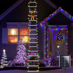 a house with christmas lights on it and a ladder in the front yard