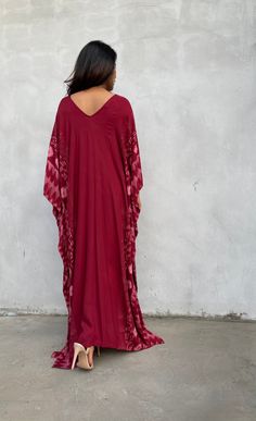 Indulge in the beauty of our classic kaftan with hand silk-screen printed fabric. This kaftan dress boasts unique patterns on high-quality rayon fabric. Its versatile design allows you to create many stylish looks, ensuring you always feel your best, whether you're at home or stepping out. Festive Printed V-neck Kaftan, Red Silk Flowy Maxi Dress, Red Flowy V-neck Kaftan, Bohemian Silk Dress With Ikat Print, Rayon Maxi Length Kaftan, Festival Tunic Kaftan With Printed Motifs, Traditional Silk Flowy Kaftan, Flowy Red Printed Kaftan, Red V-neck Free Size Kaftan