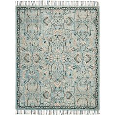 a blue and beige rug with fringes on the bottom, in front of a white background