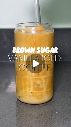 a glass jar filled with vanilla iced coffee