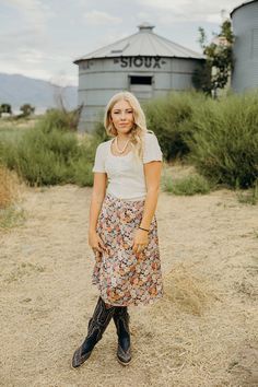 Elevate your fall wardrobe with the Mayra Skirt! This midi-length western skirt boasts a stunning floral print and comfortable elastic waistband. Perfect for any occasion, it's a must-have addition to your collection. Experience effortless style and comfort with the Mayra Skirt. Codi is wearing size small paired with The Lili Bodysuit and Ariat Casanova Boots Floral Print Rayon Midi Skirt, Flowy Floral Print Rayon Skirt, Flowy Rayon Maxi Skirt With Floral Print, Bohemian Midi Skirt In Rayon, Bohemian Midi Rayon Skirt, Bohemian Rayon Midi Skirt, Fall Floral Print Relaxed Maxi Skirt, Floral Print Relaxed Fit Maxi Skirt For Fall, Floral Print Relaxed Maxi Skirt For Fall