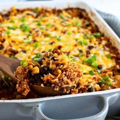 a casserole dish filled with rice and beans