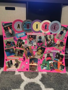 a pink bulletin board with pictures on it