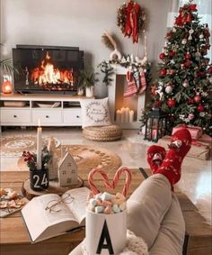 a living room filled with furniture and christmas decorations