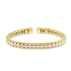 Inspired by the enchanting Italian region, the Venetian Box link endures as a testament to the skilled artisans who continue to craft it today. Crafted from real 14K gold, this bracelet features two rows of interlocking yellow gold links, with a white gold bar in the middle, hand polished for high shine. This is a cuff-style bracelet and can work easily without the fuss of a clasp. The bracelet is slightly flexible and molds to most average wrist sizes for both men and women. This piece will be Timeless White Bracelet With Polished Finish, White Timeless Bracelets With Polished Finish, Timeless White Bracelets With Polished Finish, Formal White Jubilee Cuff Bracelet, Modern White Bracelets With Solid Link Construction, Modern White Chain Bracelet For Formal Occasions, Elegant White Bracelet With Solid Link Construction, 14k Yellow Gold Tarnish-resistant Cuban Link Bracelet, Yellow Gold-plated Cuban Link Bracelet