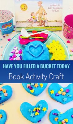 the book have you filled a bucket today? is on display next to some heart shaped cookies