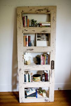 a book shelf made out of an old door