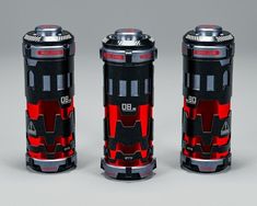 three red and black canisters sitting next to each other on a gray surface