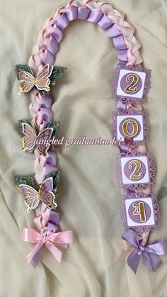 the number twenty two decorated with butterflies and ribbons