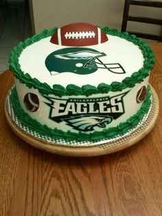 a football themed cake on a wooden table