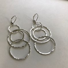 Sterling Silver Interlocking Circle Multi Hammered Sterling Silver Hoop Handmade Dangle Lightweight Earrings With Sterling Silver Leverback earrings. *These sterling silver interlocking hoop earrings are handmade and hammered for a beautiful finish. *They are lightweight earrings with lever backs for perfect fit. *They include a pair of Sterling Silver lever back earrings, though the option of a Sterling Silver french wire is available. *Handmade and lightweight *18 gauge Sterling Silver *Leverb Silver Bar Earrings, Long Pearl Earrings, Mixed Metal Earrings, Hammered Hoop Earrings, Earrings Bridesmaid, Hammered Sterling Silver, Leverback Earrings, Large Earrings, Small Earrings