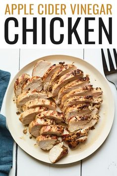 sliced chicken on a plate with fork and knife next to it, ready to be eaten