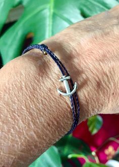 Simple and easy to wear deep ocean blue anchor bracelet. Adjustable, great for men and women. Handmade with care.  perfect for sailors, surfers, ocean lovers and watermen and waterwomen 💙 the cord is 100% waterproof so leave on to swim and surf! comfortable and easy to wear PLEASE MESSAGE ME FOR LARGER QUANTITY OR DIFFERENT COLORS OR SIZES!  SEE ALL MY BRACELETS AND ANKLETS HERE: https://www.etsy.com/shop/LOphoto808?ref=l2-shopheader-name§ion_id=19725982 please contact me here: https://www.etsy Adjustable Blue Nautical Bracelets, Nautical Blue Bracelets For Gifts, Nautical Blue Bracelets As A Gift, Adjustable Blue Nautical Bracelet, Blue Nautical Bracelets For Gift, Blue Nautical Bracelets As Gifts, Adjustable Blue Nautical Jewelry, Adjustable Nautical Blue Jewelry, Blue Nautical Style Bracelet For Gift