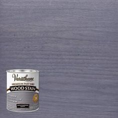 a can of wood stain sitting on top of a table