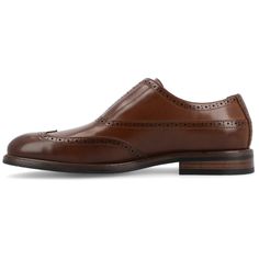 Introducing the Nikola slip-on oxford from Vance Co., a perfect blend of style and comfort with its 1-inch block heel, slip-on silhouette, and almond toe design. Crafted from faux leather with a this style offers a sophisticated and versatile option for various occasions. The faux leather lining, 6 mm Tru Comfort Foam™ footbed, and rubber outer sole ensure both style and comfort, making the Nikola a trendy and practical addition to your footwear collection. Fall Brogue Detailing Slip-on Oxfords, Classic Wingtip Slip-ons For Work, Fall Slip-on Oxfords With Brogue Detailing, Classic Semi-formal Slip-ons For Spring, Classic Wingtip Slip-ons With Brogue Detailing, Classic Spring Business Casual Slip-ons, Spring Business Casual Wingtip Slip-ons, Spring Slip-on Oxford Dress Shoes, Spring Slip-on Dress Shoes With Brogue Detailing