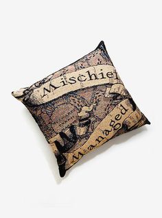 a pillow that is sitting on top of a white surface with the word mische printed on it