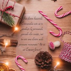 a christmas message on a piece of paper surrounded by candy canes and candies