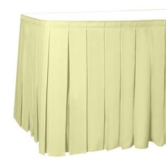 a yellow pleated table skirt on a white background