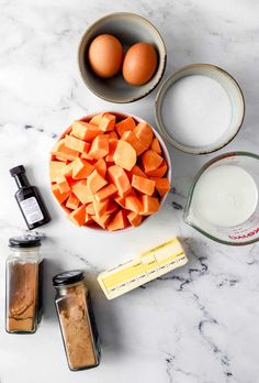 carrots, eggs and other ingredients on a table