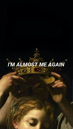 a man holding a crown over his head with the words i'm almost me again