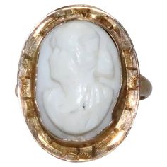 10 KT yellow gold cameo ring with unique designing. This ring is sized as 5 1/4 which could be resized if needed and is weighted 3.0 grams. The ring is hallmarked 10 K gold and has also been checked for authenticity. Cameo 14k Gold Rings For Collectors, 14k Gold Cameo Rings For Collectors, Collectible 14k Gold Cameo Rings, Victorian Gold Cameo Rings, White Cameo Rings For Wedding, Oval Carved White Ring, White Oval Carved Ring, White Oval Carved Rings, White Cameo Wedding Rings