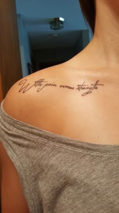 a woman with a tattoo on her shoulder that says, we are your own strength